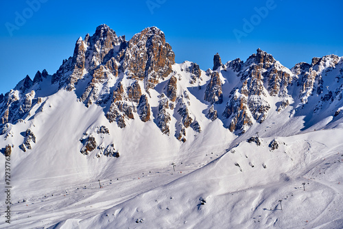 Breathtaking beautiful panoramic view on Snow Alps - snow-capped winter mountain peaks around French Alps mountains, The Three Valleys: Courchevel, Val Thorens, Meribel (Les Trois Vallees), France photo