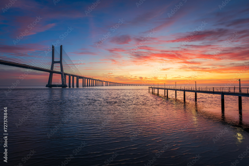 Vasco da Gama bridge and pier over tagus river in Lisbon (Portugal),before sunrise