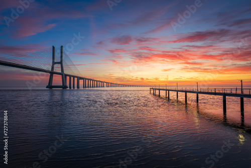 Vasco da Gama bridge and pier over tagus river in Lisbon (Portugal),before sunrise © p_rocha