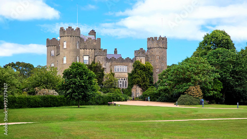 Medieval Malahide Castle with green front garden, Dublin County, Ireland