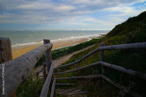 path with wooden border going down to Villerville beach in Normandy photo