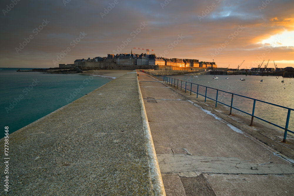Saint-Malo intramural at sunrise from the Moles des Noirs pier Saint-Malo intramural at sunrise from the Moles des Noirs pier