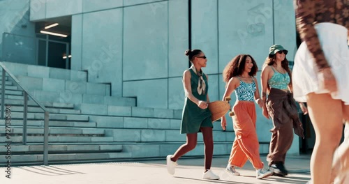 Women, friends and walk in city with gen z people, fashion and conversation in street with trendy style. Girl, chat and happy with edgy clothes, outdoor and urban sidewalk with sunshine in Cape Town photo