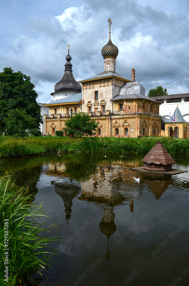 View of the Orthodox church, lake, reflection in the water, travel around Russia