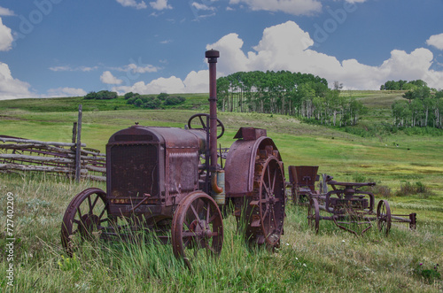wheeled vehicles of days gone by, tanker, wagon, and tractor.