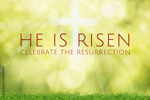 Easter illustration with the text 'He is Risen', a shining cross and a blurred yellow and green bokeh background with grass.