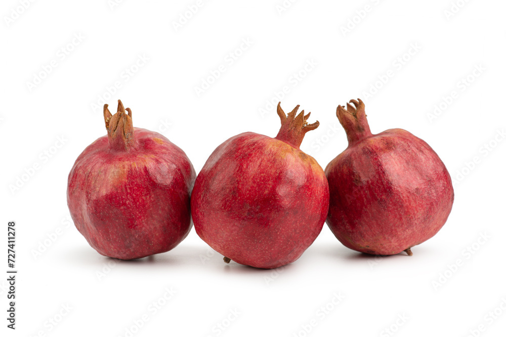 Pomegranate fruit on a white isolated background Pomegranate fruit on a white isolated background