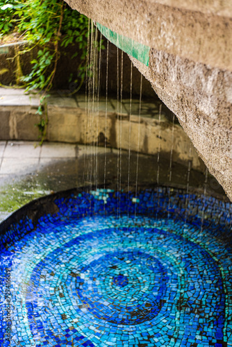 Water fontain with blue mosaic photo