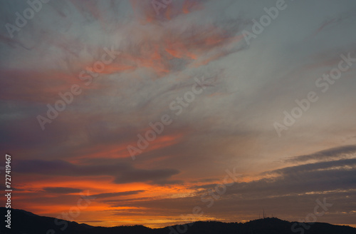 Calm sea with sunset sky and sun through the clouds over. sea and sky background. 