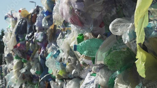 a PLASTIC BOTTLE in the trash