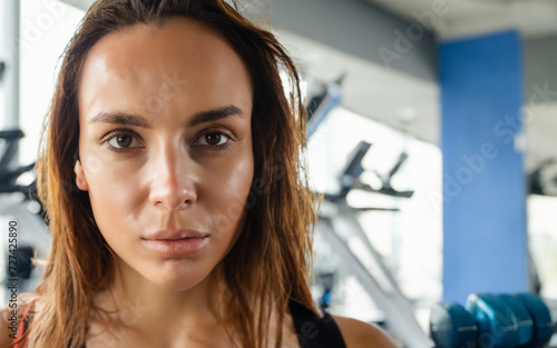 Woman Sweating Workout in Gym Background