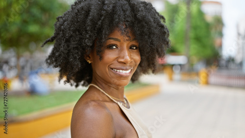 African american woman smiling confident standing at park