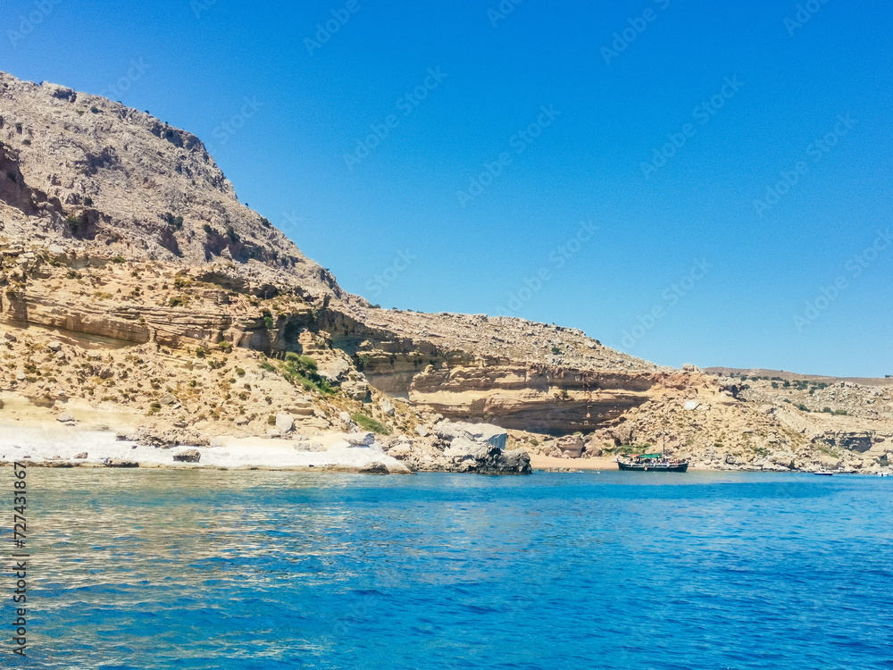 General landscape, in Lindos, Greece. Turquoise Mediterranean Sea and rocks.