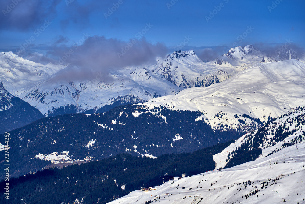 Breathtaking beautiful panoramic view on Snow Alps - snow-capped winter mountain peaks around French Alps mountains, The Three Valleys: Courchevel, Val Thorens, Meribel (Les Trois Vallees), France