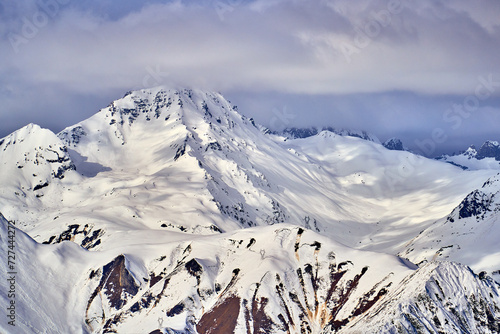 Breathtaking beautiful panoramic view on Snow Alps - snow-capped winter mountain peaks around French Alps mountains, The Three Valleys: Courchevel, Val Thorens, Meribel (Les Trois Vallees), France