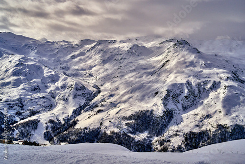 Breathtaking beautiful panoramic view on Snow Alps - snow-capped winter mountain peaks around French Alps mountains, The Three Valleys: Courchevel, Val Thorens, Meribel (Les Trois Vallees), France photo