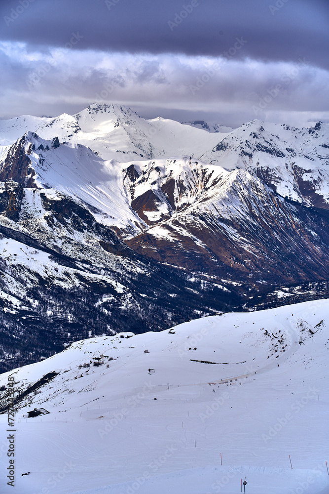 Breathtaking beautiful panoramic view on Snow Alps - snow-capped winter mountain peaks around French Alps mountains, The Three Valleys: Courchevel, Val Thorens, Meribel (Les Trois Vallees), France