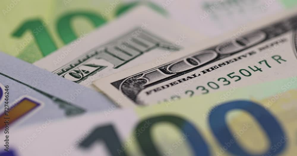 cash one hundred euros and 100 dollars close-up, genuine cash from the European Union and the USA cash one hundred euros and 100 dollars close-up, genuine cash from the European Union and the USA