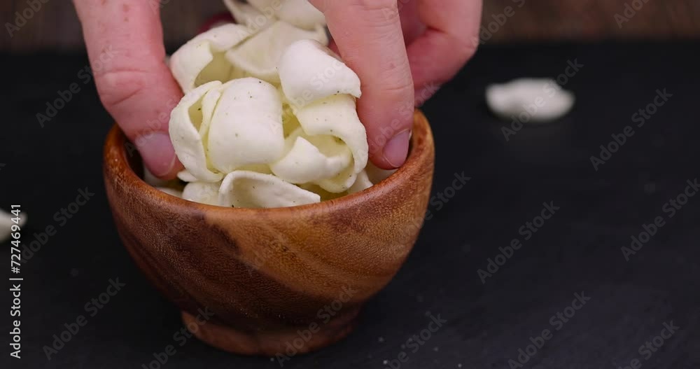potato chips made of mashed potatoes with spices, delicious but harmful chips made of mashed potatoes and fragrant herbal spices potato chips made of mashed potatoes with spices, delicious but harmful chips made of mashed potatoes and fragrant herbal spices