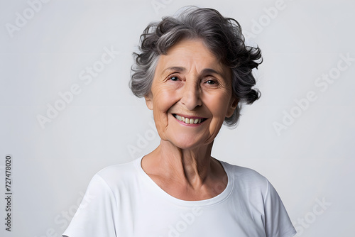 portrait of a senior woman with grey hair smiling  