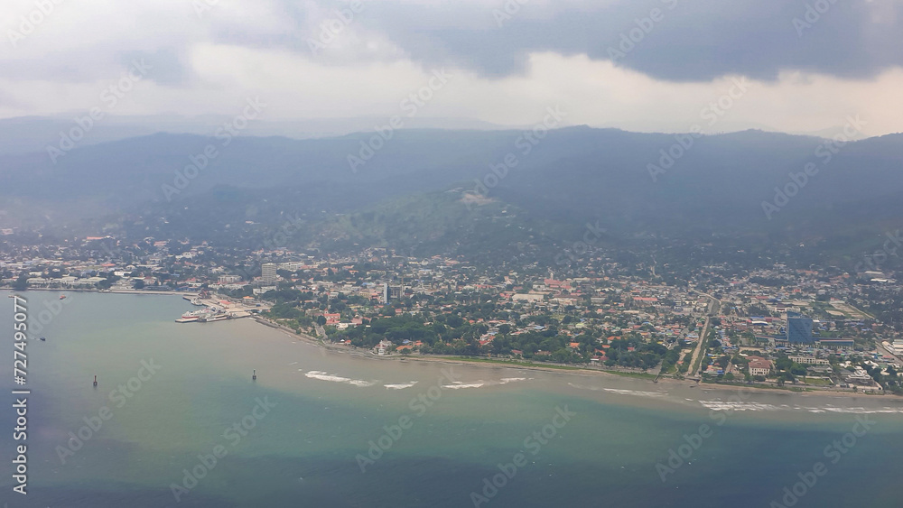 Naklejka premium Aerial panoramic view of the capital city of Dili in Timor-Leste, Southeast Asia 