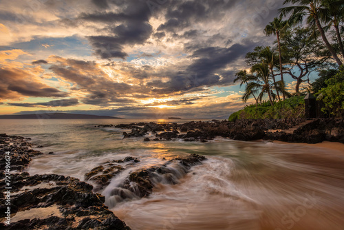 Maui's Secret Pa'ako Cove at sunset with a dramatic sky