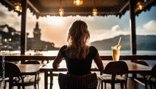  back view of silhouette of person sitting alone at the bar