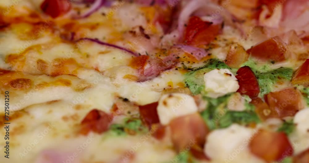 pizza using a large number of different ingredients close-up, background of fresh hot pizza pizza using a large number of different ingredients close-up, background of fresh hot pizza