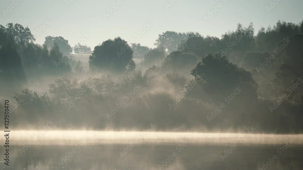 Foggy morning landscape. Fog over autumn lake water. Povoa e Meadas Dam in Castelo de Vide, Alentejo Portugal.