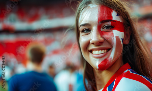 Cheerful and enthusiastic England woman, with her face painted with the colors of the England flag, cheering as a fan at a sporting event, such as a soccer match.