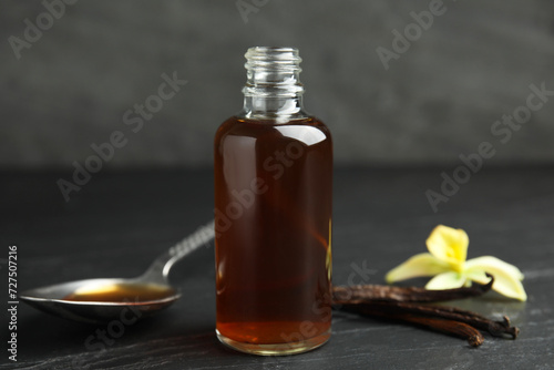 Wallpaper Mural Aromatic homemade vanilla extract on black table Torontodigital.ca