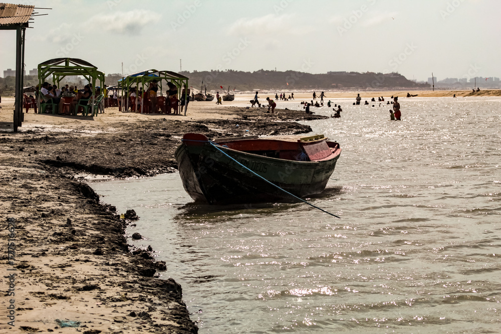 A boat on the beach of Mangue Seco, Municipality of Raposa MA, Brazil, with a blurred background