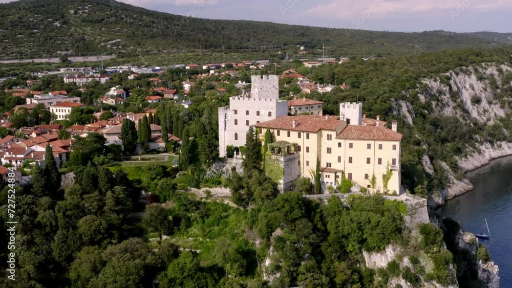 drone flying over duino's castle near to the sea in trieste drone flying over duino's castle near to the sea in trieste