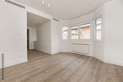 Empty room of a multi-story detached house with quality wooden floors