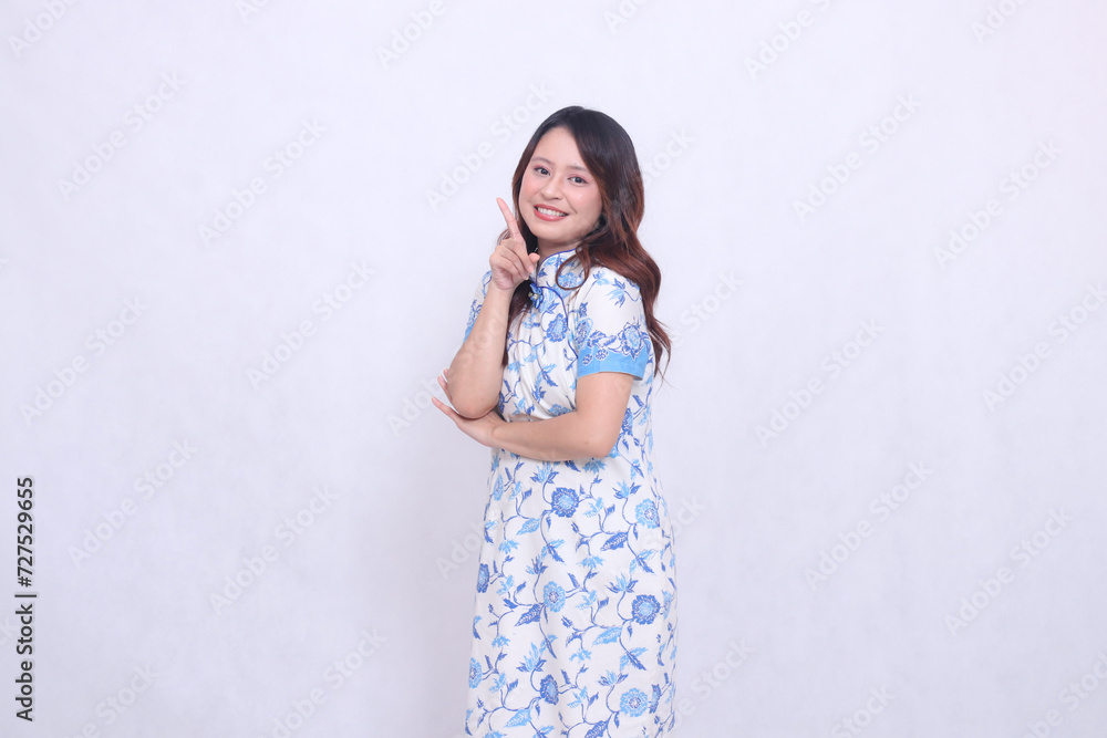 Beautiful smile asian woman wearing modern chinese dress arms crossed 1 isolated on white background. happy Chinese New Year Beautiful smile asian woman wearing modern chinese dress arms crossed 1 isolated on white background. happy Chinese New Year
