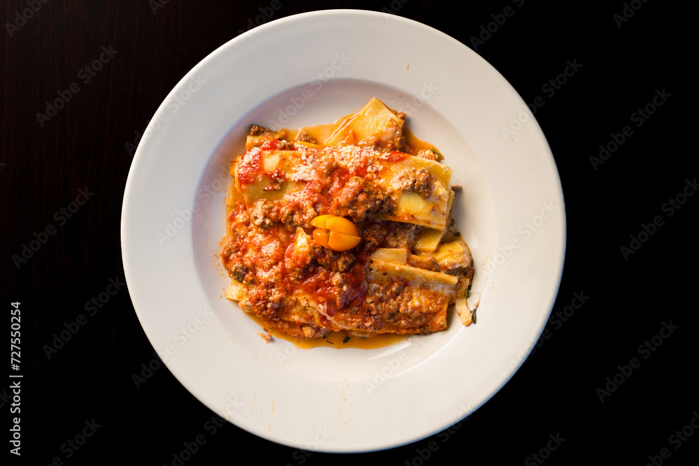 One portion of lasagna in a bowl One portion of lasagna in a bowl
