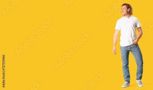 Stylish young man in jeans ...