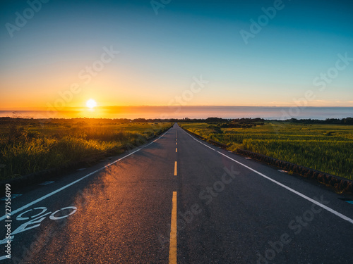 Watching the Sunrise over the Sea from the Road