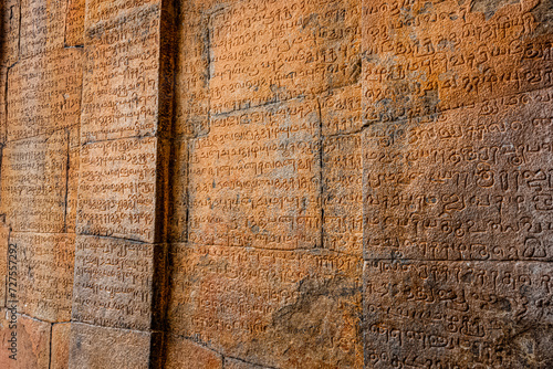 An Ancient Tamil Letters Inscription or Vattezhuthu or grantha script at Tanjore Big Temple or Brihadeshwara Temple was built by King Raja Raja Cholan, Tamil Nadu. This is UNESCO's Heritage Site. photo