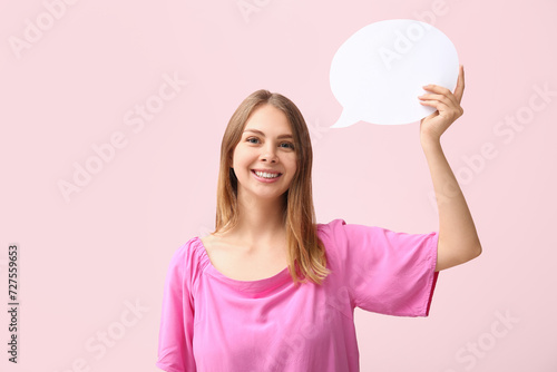Pretty young woman holding ...