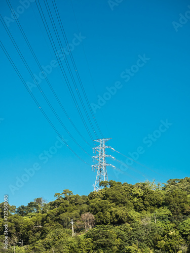 white electric tower's with blue sky