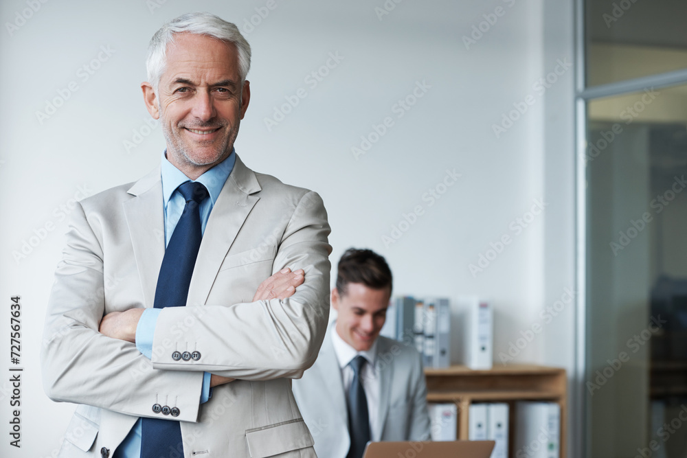 Fototapeta premium Senior businessman, portrait and confidence or mentor, agency and pride for training in office. Happy male person, arms crossed and smile for support in management, advisor and laptop for planning