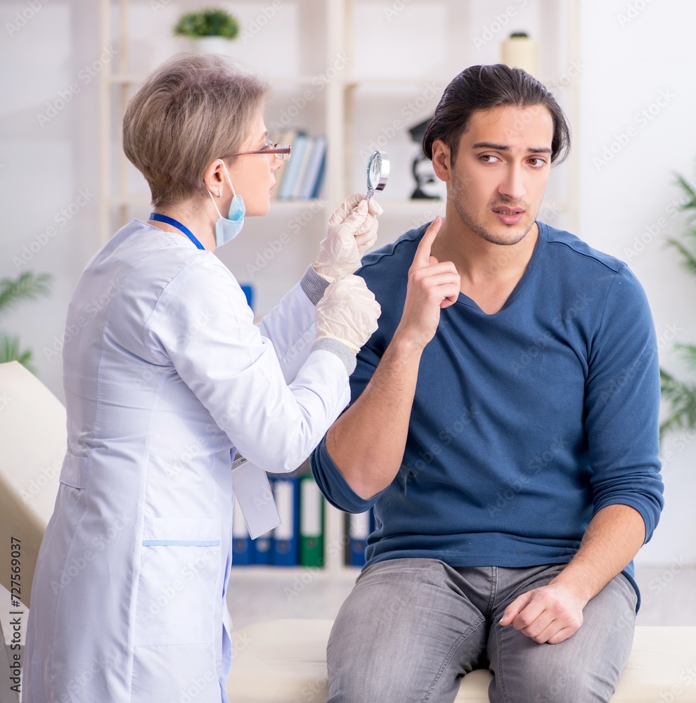 Young patient visiting doctor in hospital Young patient visiting doctor in hospital