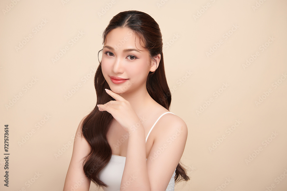 Beautiful young woman with clean fresh skin on beige background, Face care, Facial treatment, Cosmetology, beauty and spa, women portrait. Beautiful young woman with clean fresh skin on beige background, Face care, Facial treatment, Cosmetology, beauty and spa, women portrait.