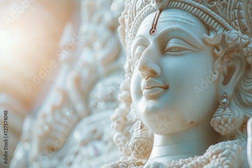 a statue of lakshmi bokeh style background