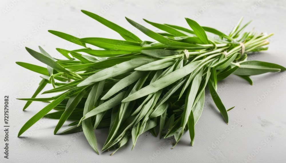 A bunch of green herbs on a white counter A bunch of green herbs on a white counter
