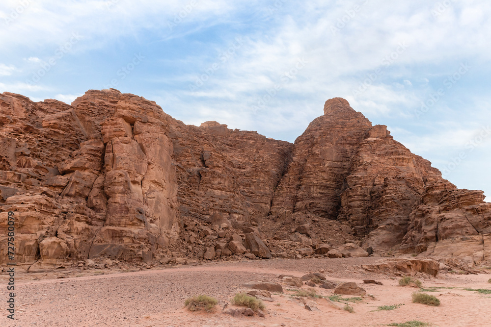 Unique beauty of the high mountains in the endless sandy red desert of the Wadi Rum near Amman in Jordan Unique beauty of the high mountains in the endless sandy red desert of the Wadi Rum near Amman in Jordan
