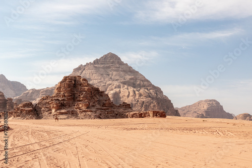 Beautiful magnificent high mountains in the endless sandy red desert of the Wadi Rum near Amman in Jordan