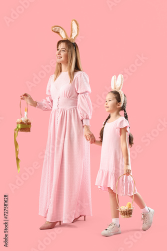 Cute little girl with her m...