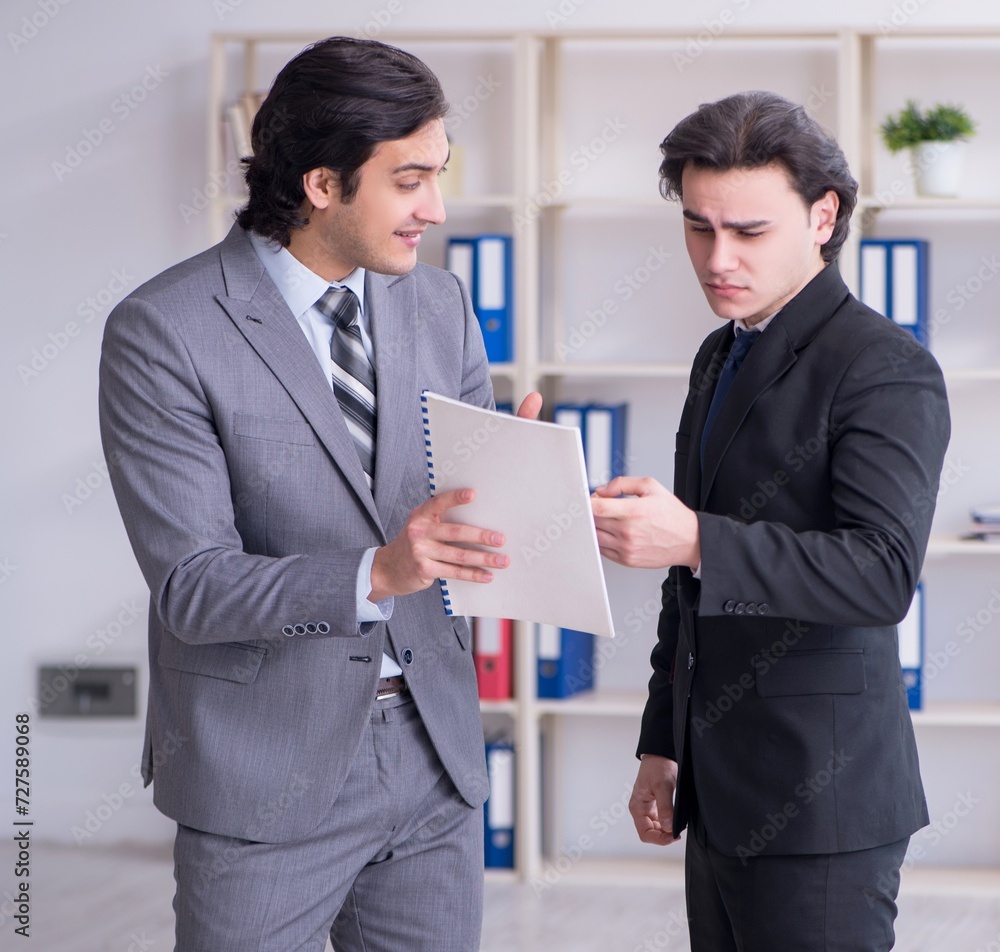 Two young businessmen meeting in the office Two young businessmen meeting in the office